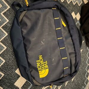 The North Face Base camp Voyager Blue and Yellow sling bag